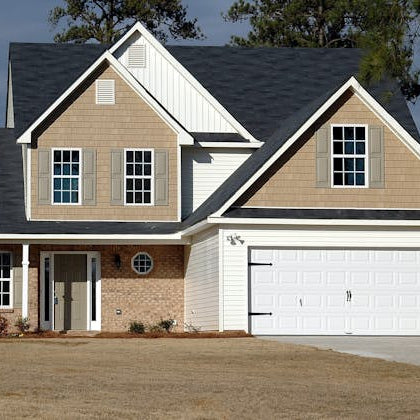 Completed home exterior with siding and roofing in Brighton Colorado