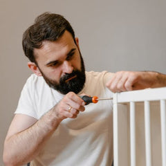 Close-up of furniture parts with dowels and drill holes, highlighting the attention to detail and precision of professional furniture assembly services.