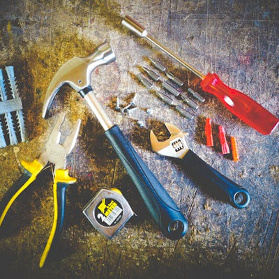 handyman tools including hammer, pliers, screwdriver, and tape measure used by Rocky Ridge Handyman for home repair services in Westminster, Thornton, and Brighton Colorado